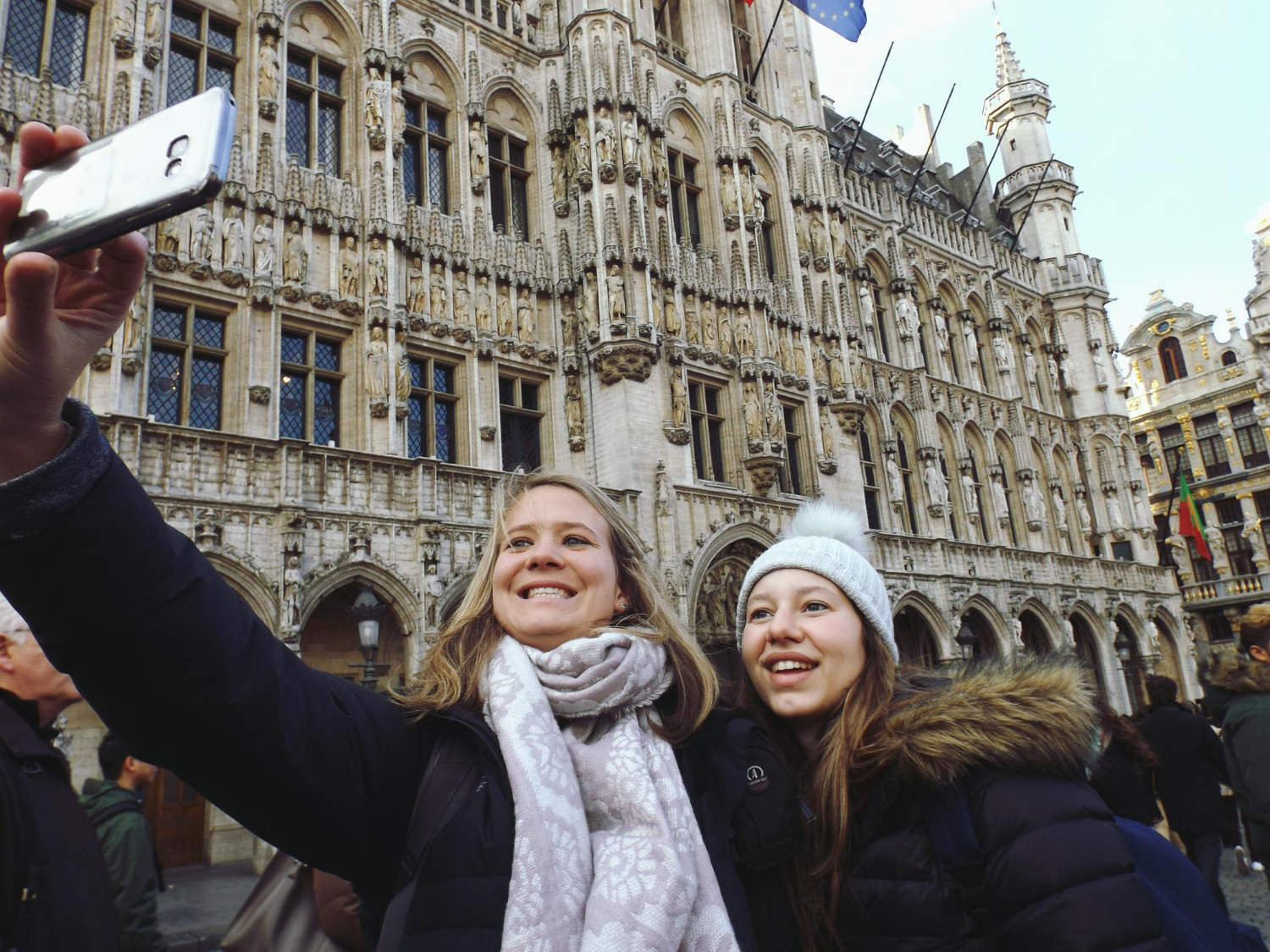 Smiling young women taking selfie.jpg